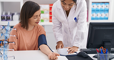 medical professional measuring blood pressure of a patient in a clinical setting showcasing health check eight vital signs