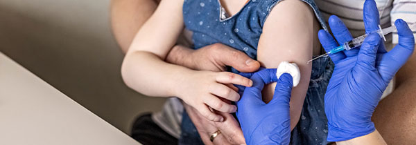 child receiving vaccination with parental support in a clinical setting 10 important health tips