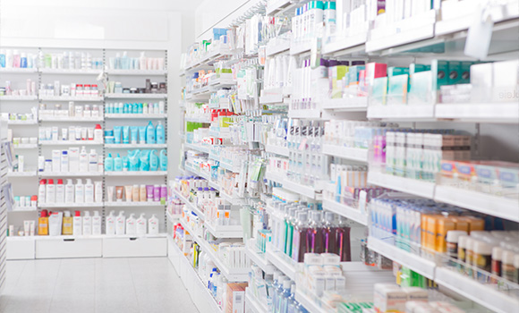 a well-organized pharmacy aisle filled with various skincare and health products including bottles tubes and boxes showcasing options for personal care and beauty with a focus on solutions for consumers looking for effective remedies and treatments